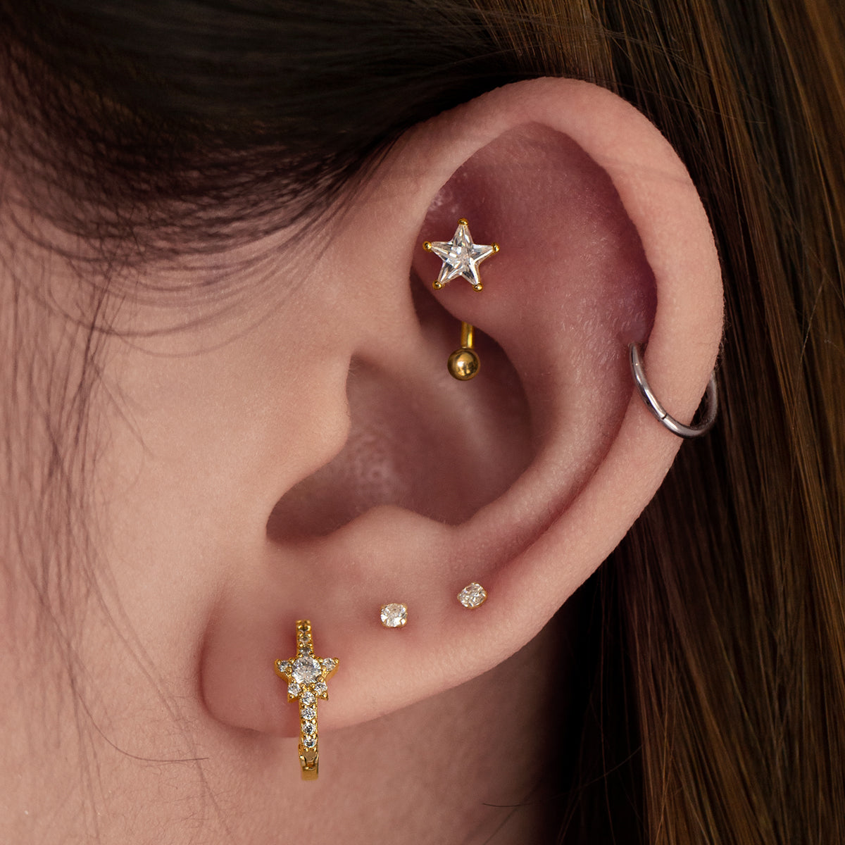 Starburst Gemstone Rook Curved Barbell Piercing On Model - Gold