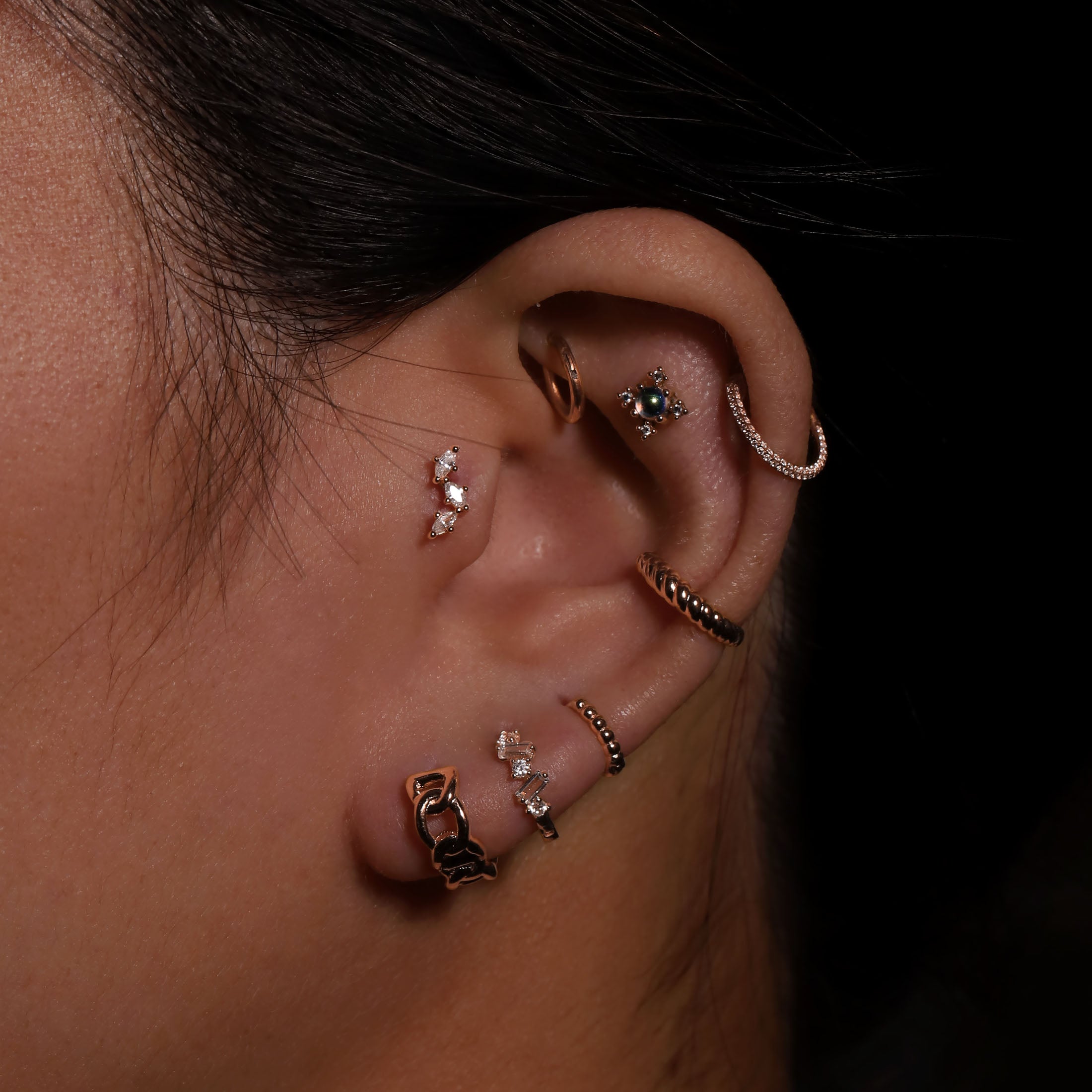 Atmos Textured Huggie Hoop Earrings On Model 2 - Rose Gold