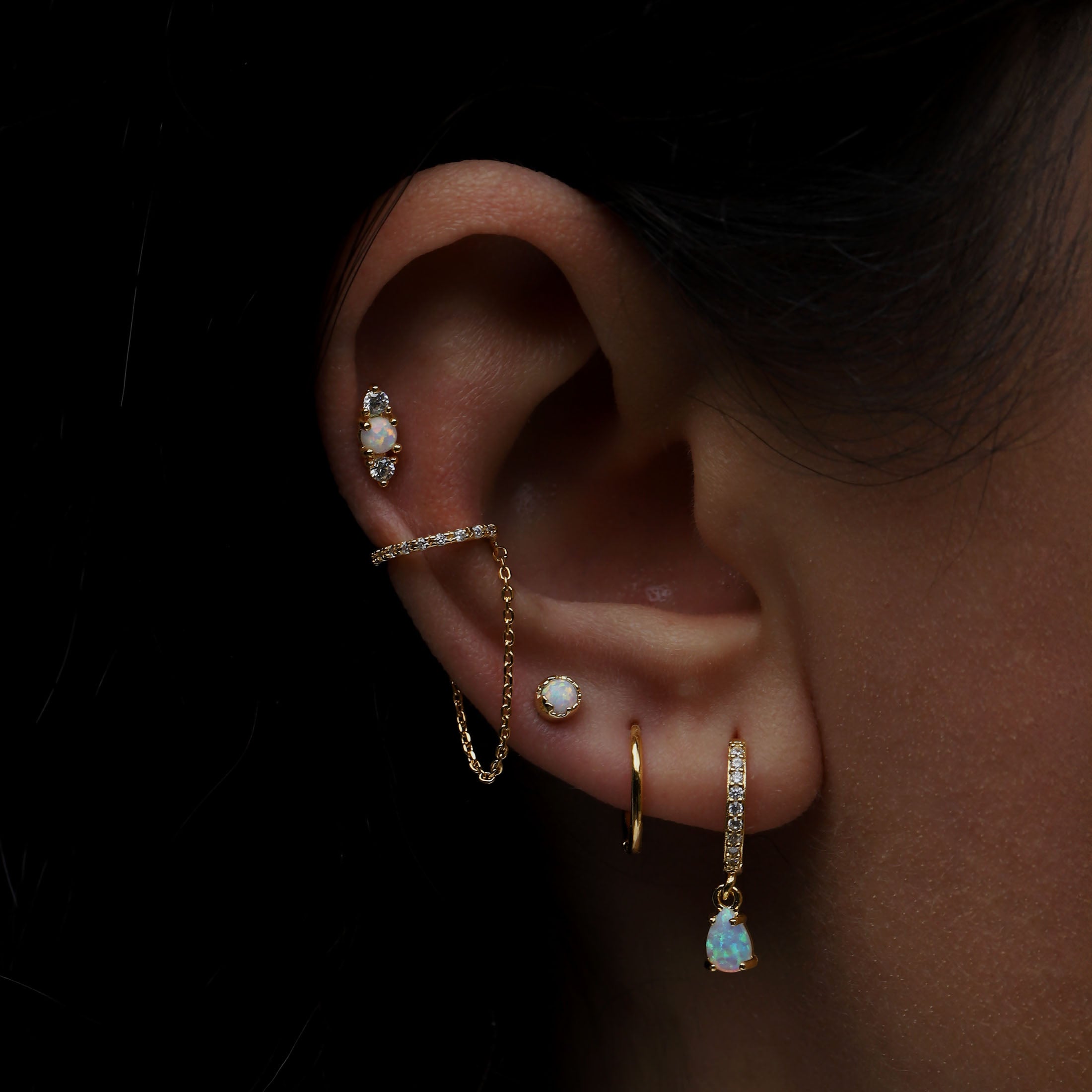 Glory Opal Helix Tragus Cartilage & Conch Ear Piercing On Model - Gold