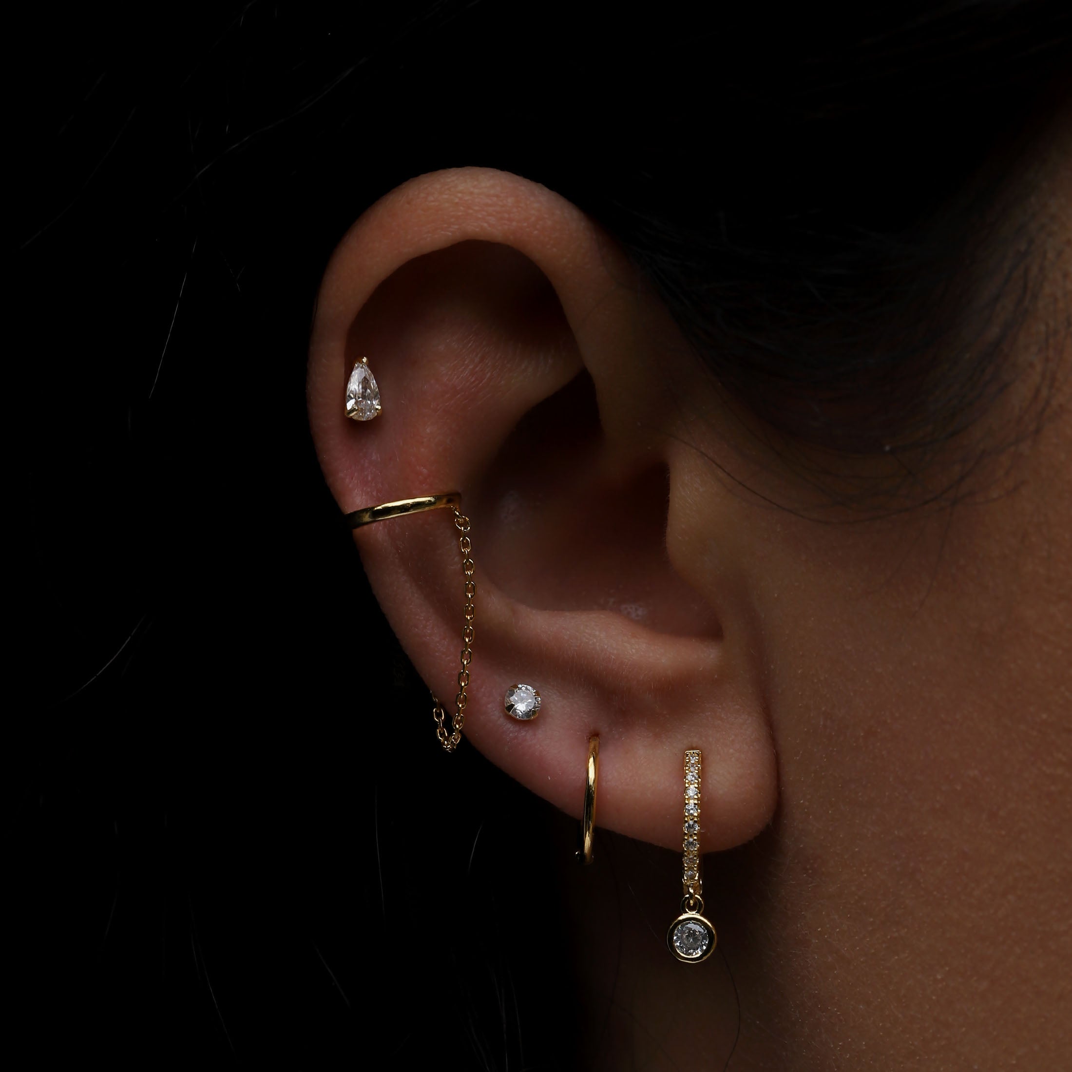 Lithe Tragus Helix Cartilage & Conch Ear Piercing On Model - 14K Solid Gold