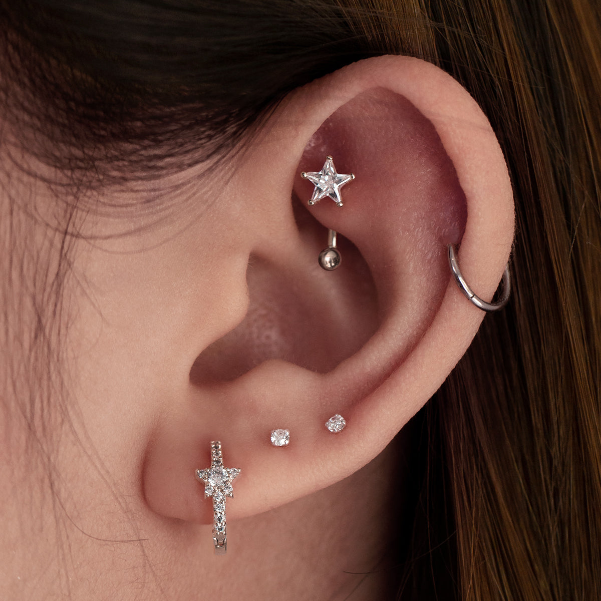 Starburst Gemstone Rook Curved Barbell Piercing On Model - Silver