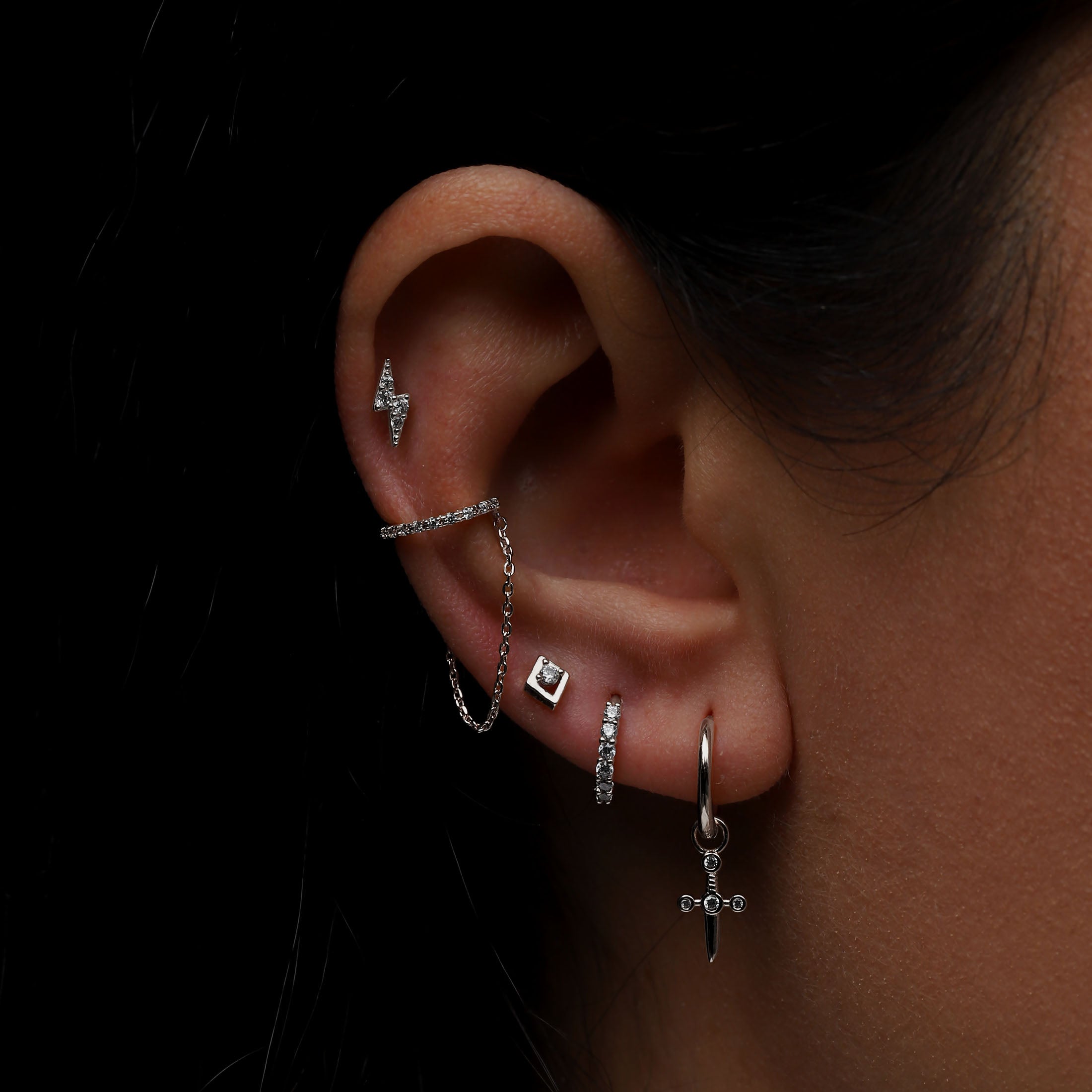 Dagger Charm Huggie Hoop Earrings On Model - Sterling Silver