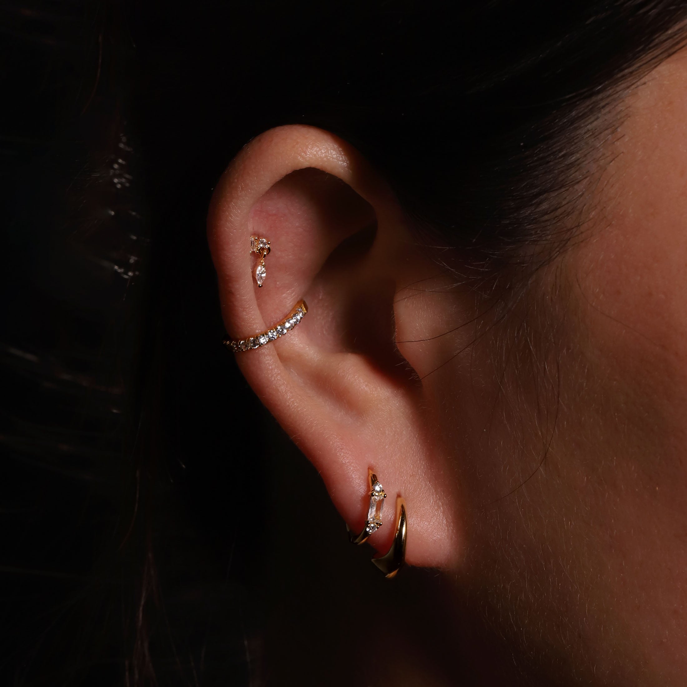 Elixir Curved Geometric Hoop Earrings On Model - Gold
